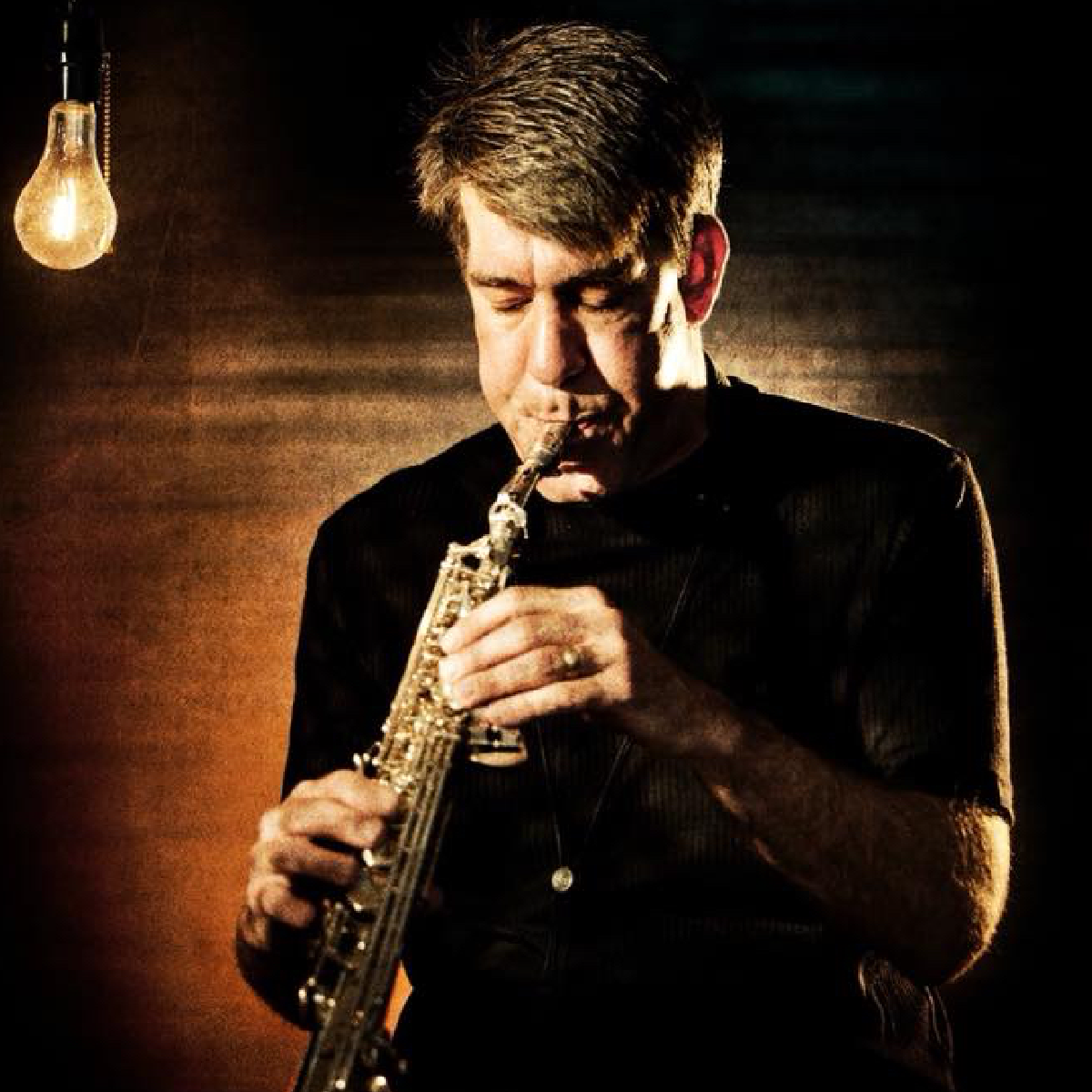 Musician Daniel Ian Smith playing saxophone