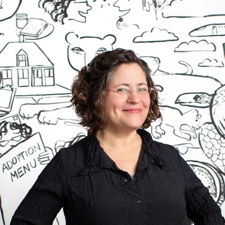 performer Phoebe Potts against a cartoon background