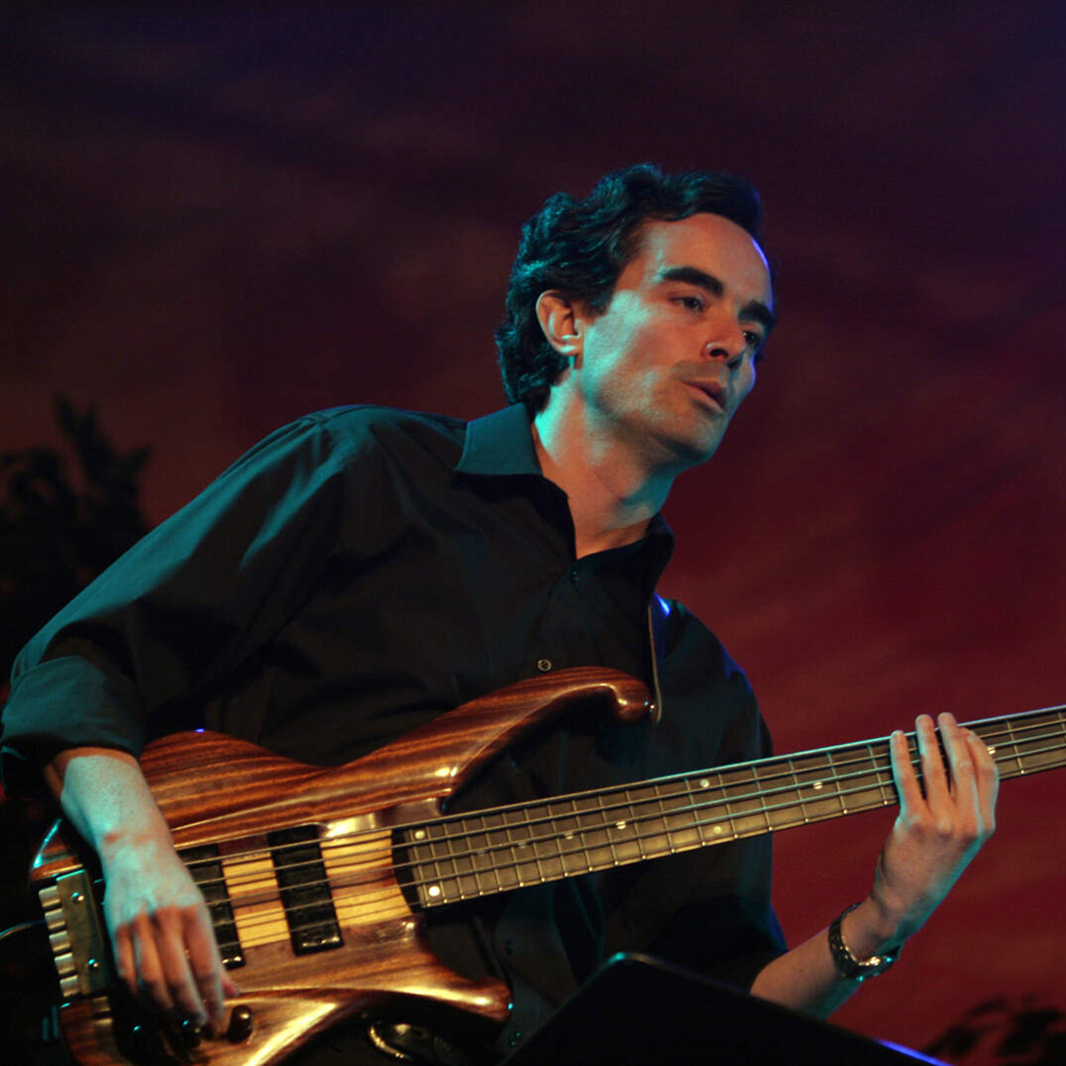 Musician Fenando Huergo playing an electric bass guitar