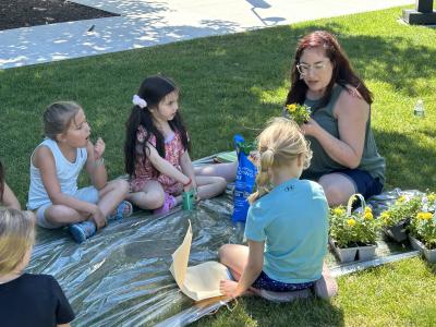 image of children working outdoors on a project