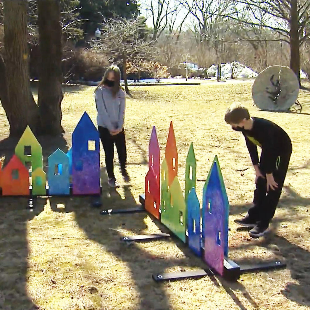 Photo of children looking at YardArt