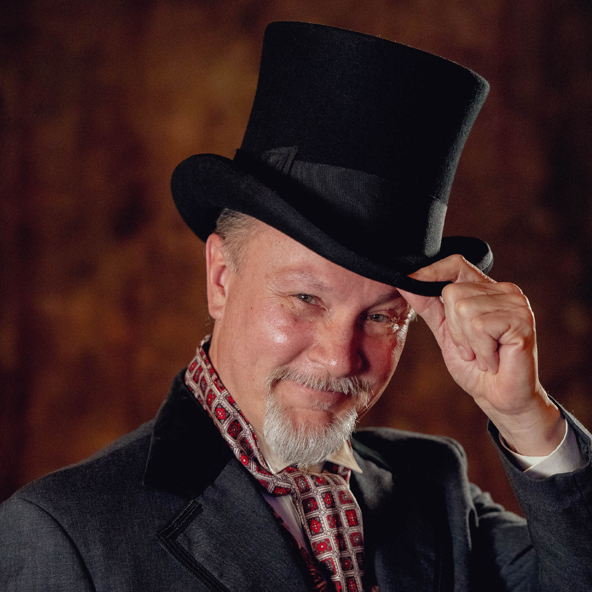 Headshot of Dick Terhune in Dickensian attire with top hat