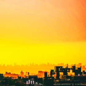 Image of a yellow hazy city skyline