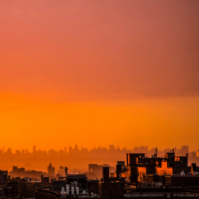 Image of an orange hazy city skyline