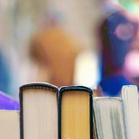 a row of books against a blurred background