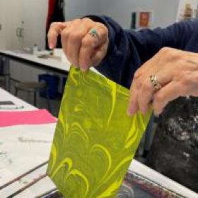 image of hands making an art project