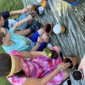 image of students doing a project outdoors