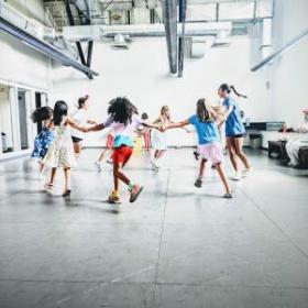 photo of children dancing together